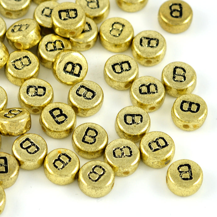Bokstavspärlor, guld, A–Z