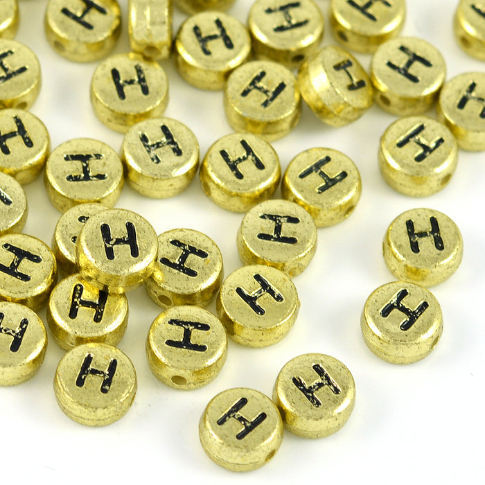 Bokstavspärlor, guld, A–Z