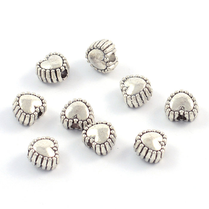 Metallpärlor, små hjärtan, antiksilver, 5mm, 50st