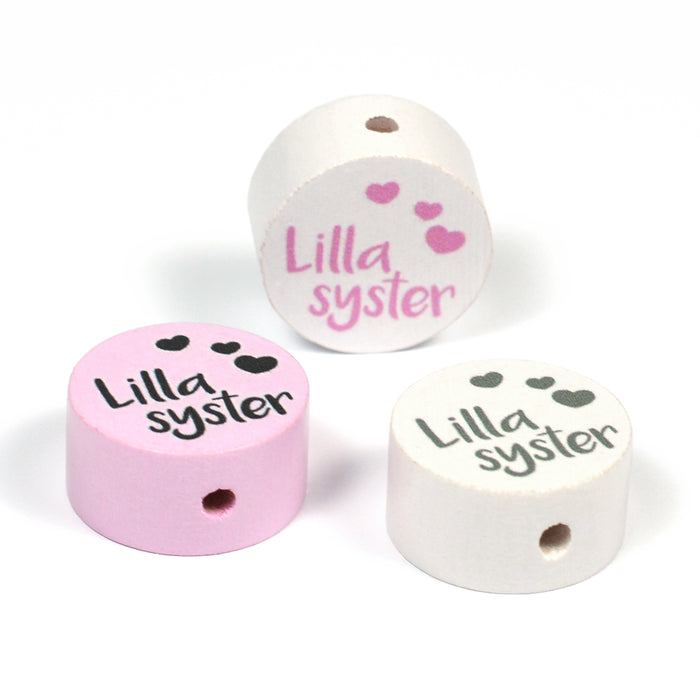 Motivpärla i trä, "Lillasyster"