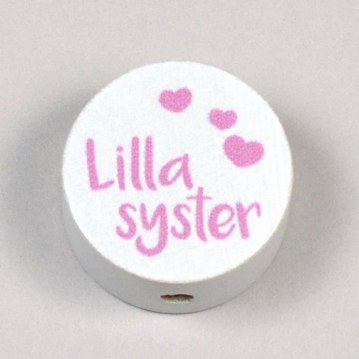 Motivpärla i trä, "Lillasyster"
