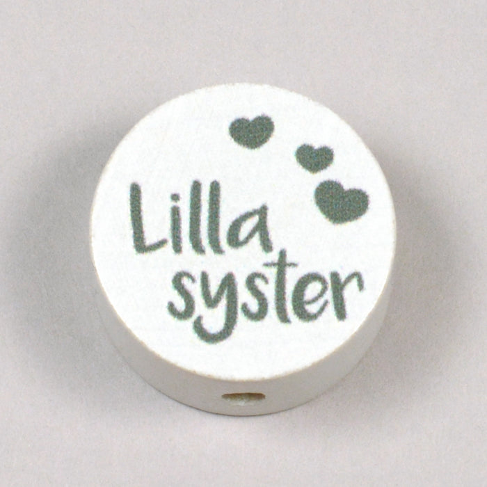 Motivpärla i trä, "Lillasyster"