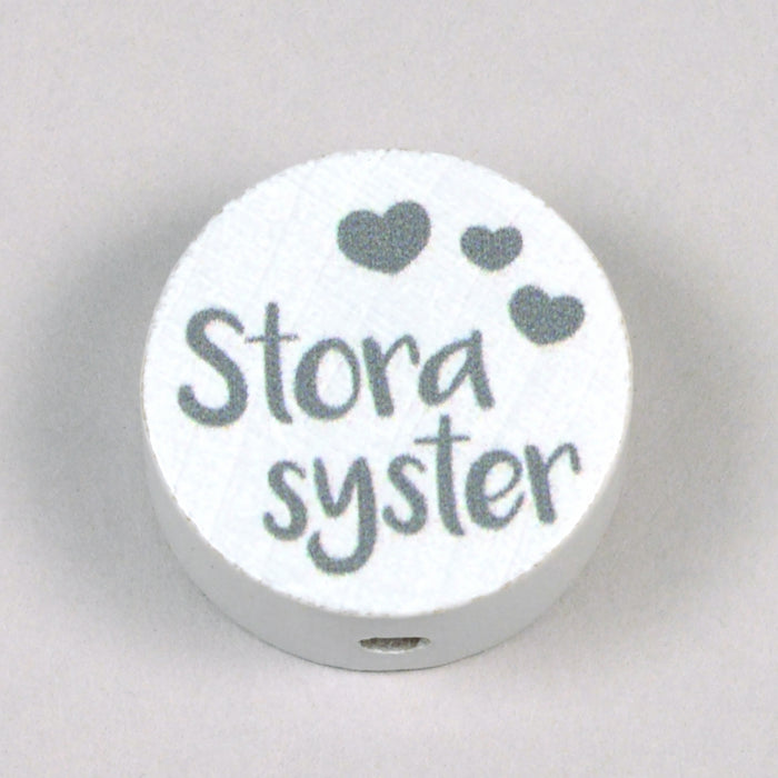 Motivpärla i trä, "Storasyster"